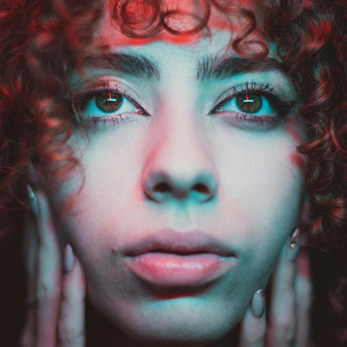 a close up of a person with curly hair