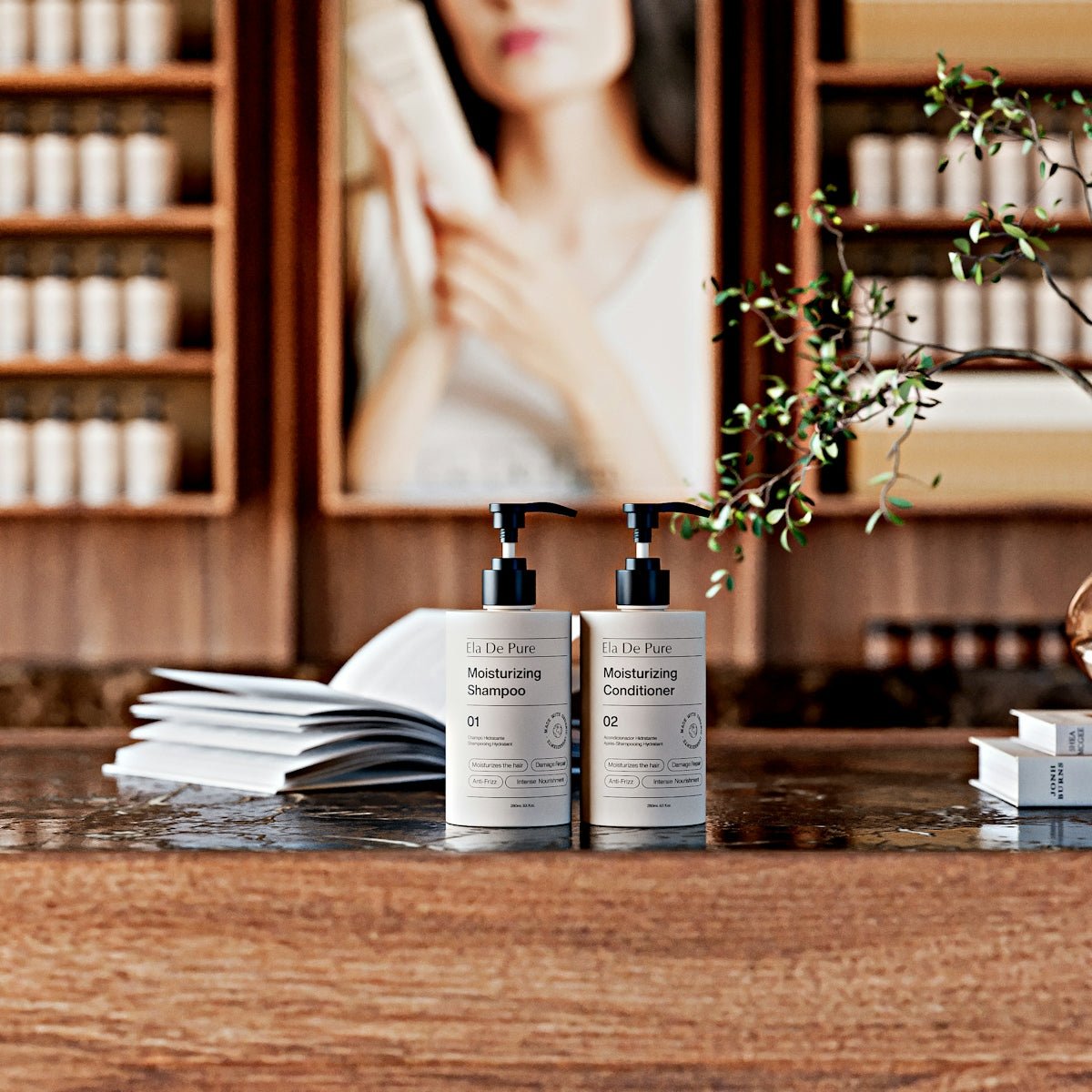 Shampoo and conditioner bottles on a wooden counter.